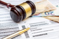 Gavel and Pen on the German Tax Form - Concept for Legal Translation
