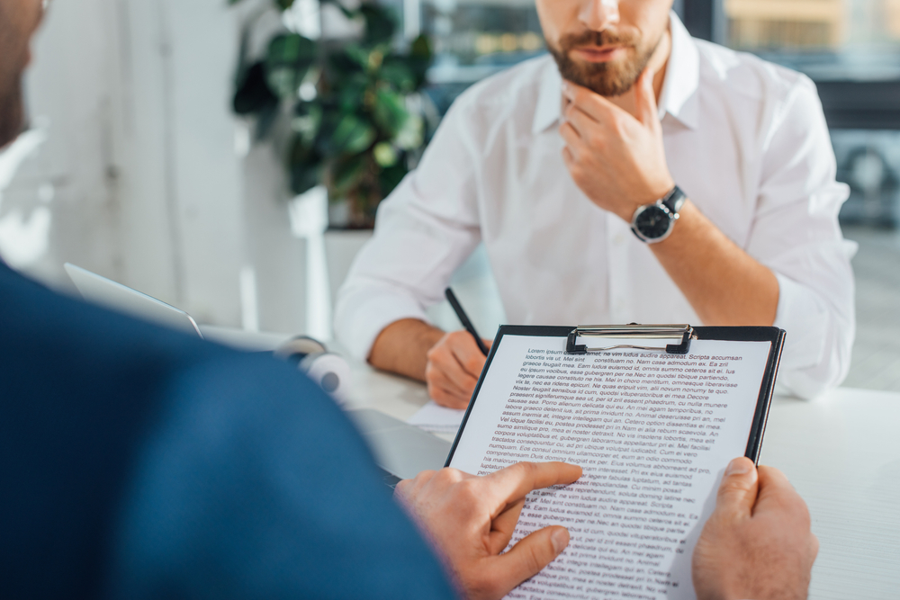 Cropped view of a woman offering translation services with a businessman